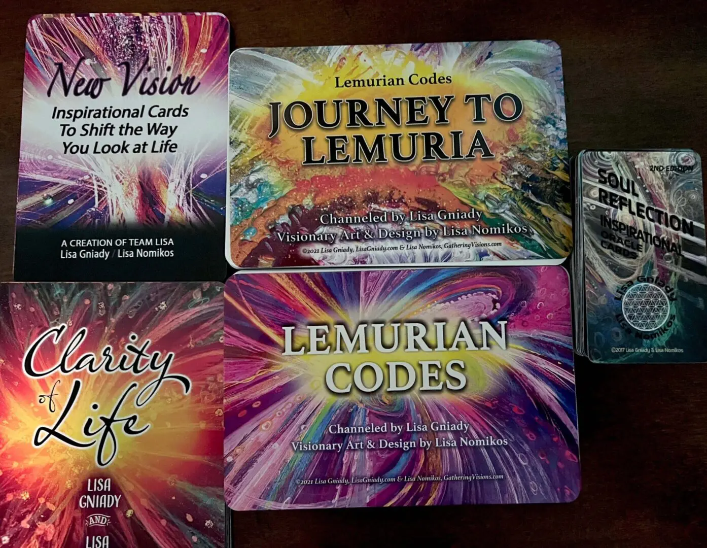 A collection of spiritual and metaphysical books and cards.