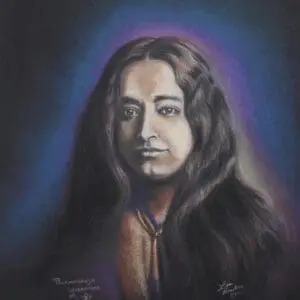 Portrait of a person with long hair against a dark background.