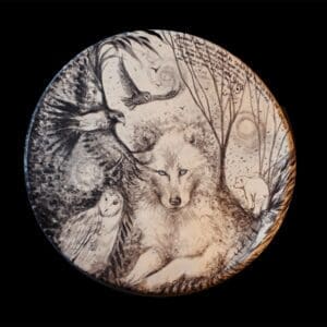 Intricately carved woodland animals on a circular wooden plaque.