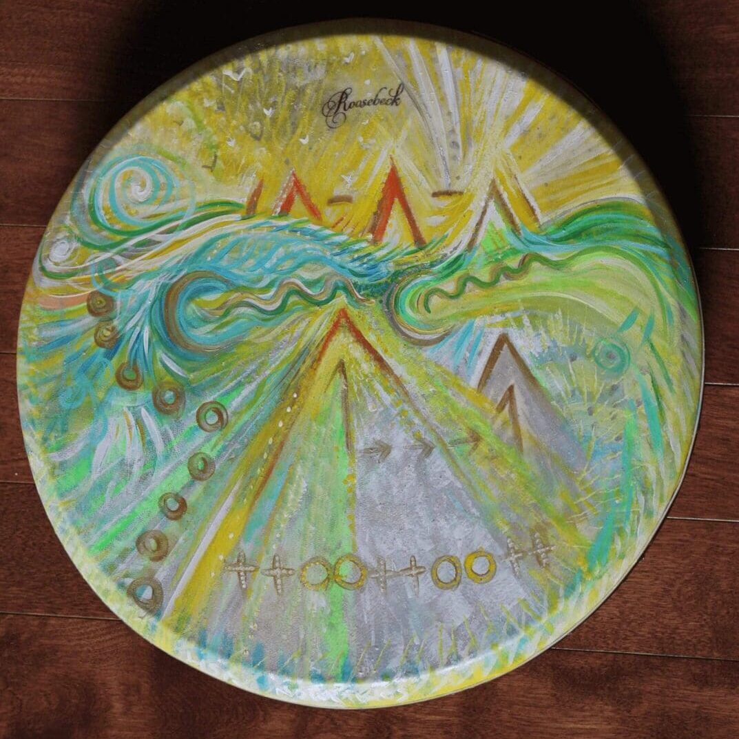 Colorful circular artwork featuring geometric shapes and flowing lines.